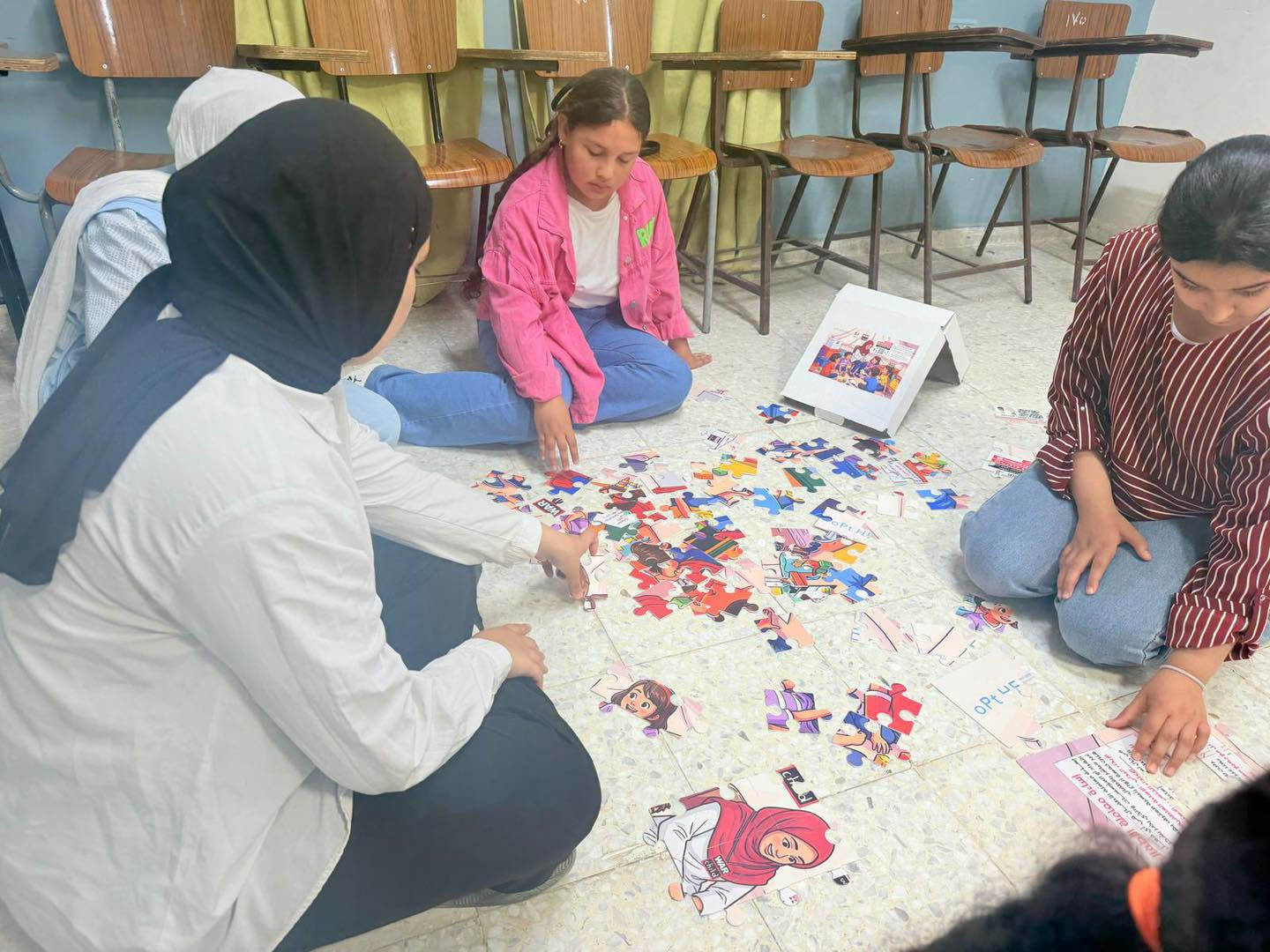 As part of the “Sumud” project to strengthen community resilience and protection, the Palestinian Child Welfare Association, in collaboration with the Nafs Empowerment Foundation, organized a recreational activity that included educational puzzle games. - 2