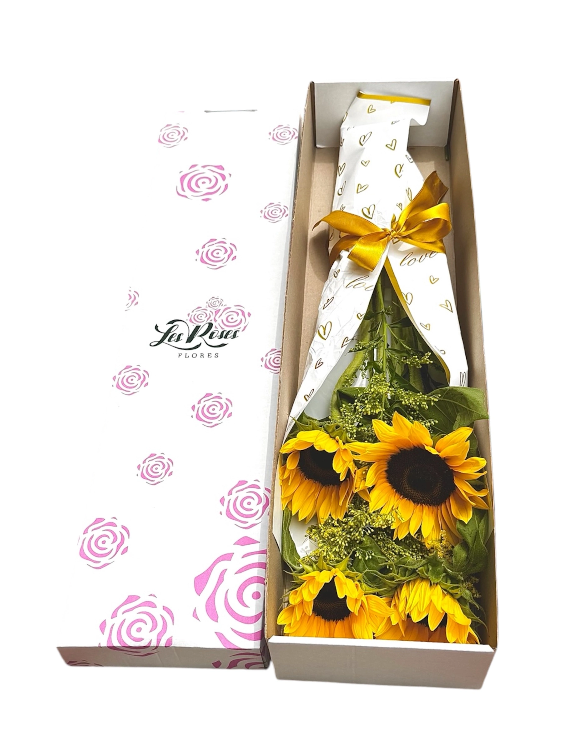 Girasoles Con Rosas Y Chocolates En Papel Kraft — Celebraciones. Arreglo floral de Flores Les Roses con envío a domicilio en Bogotá.